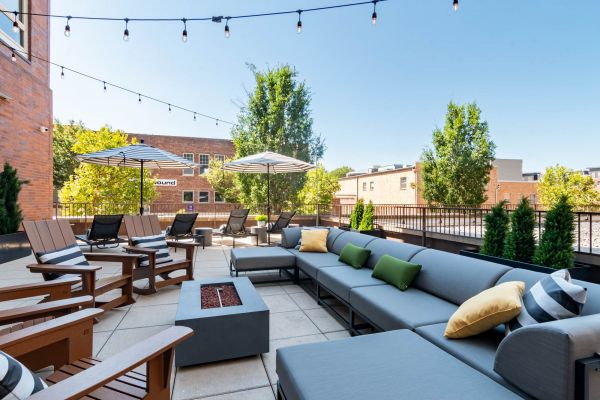 Outdoor lounge at Chronicle on 8th with fire pit seating and a relaxed resident hangout area.
